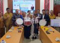 Bupati Taput Sambut Bantuan Marching Band dari AP Indonesia untuk SMPN 2 Simangumban